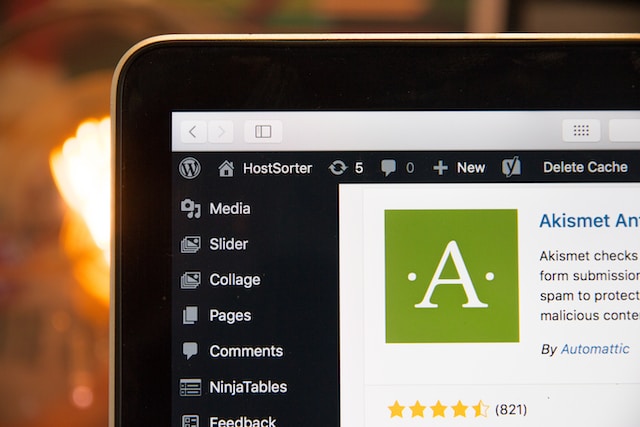 Stock photo of a laptop screen showing the WordPress admin interface, focused on the Askimet plugin